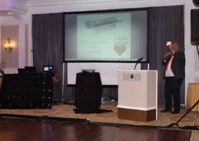 A man standing in front of a projector.