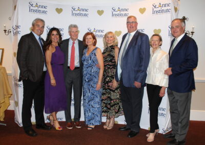 A group of people posing for a picture at an event.